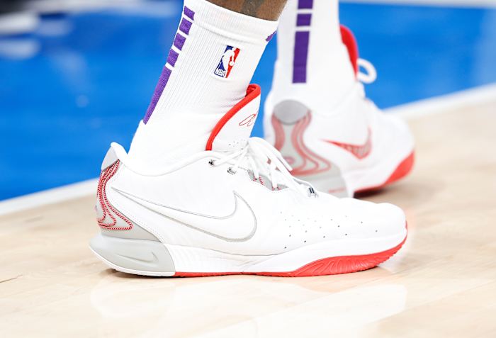 Los Angeles Lakers forward LeBron James' white and red Nike sneakers.